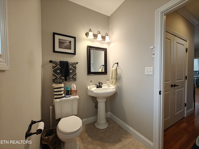 bathroom featuring tile patterned floors and toilet