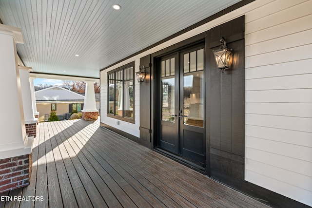 wooden terrace featuring french doors