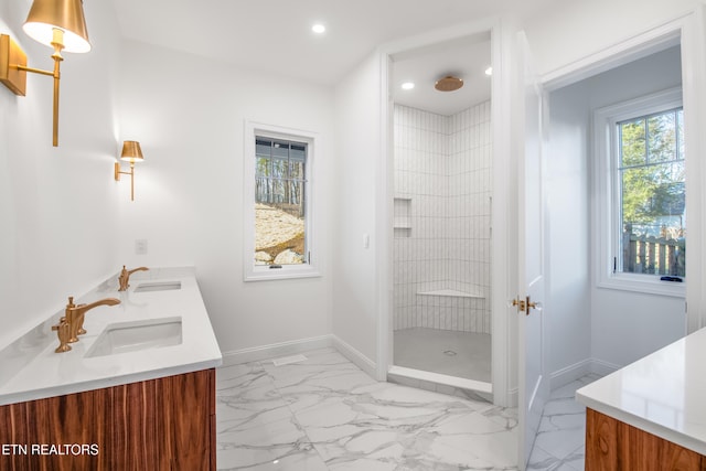 bathroom featuring vanity and a tile shower