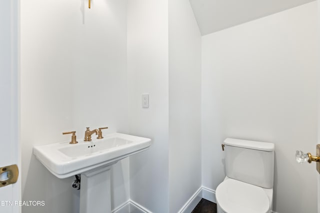 bathroom with sink and toilet