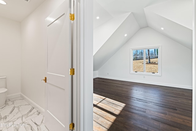 bonus room with vaulted ceiling