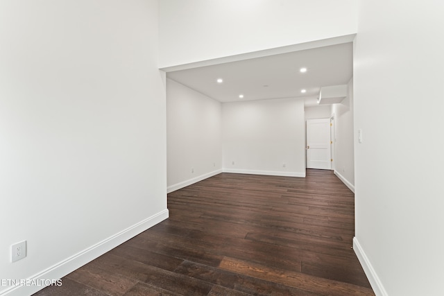 unfurnished room featuring dark hardwood / wood-style floors