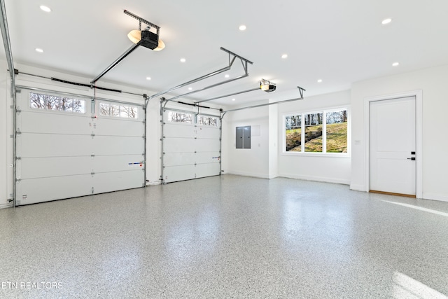 garage featuring a garage door opener and electric panel