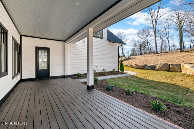 wooden deck with a yard