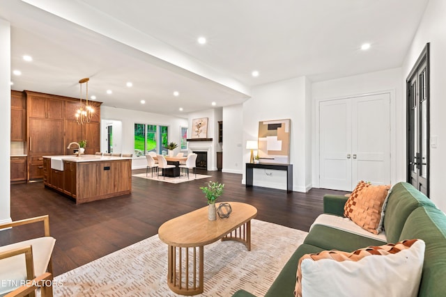 1521 Cherokee Blvd, Knoxville, TN 37919 - living room with dark wood-style flooring, recessed lighting, and baseboards