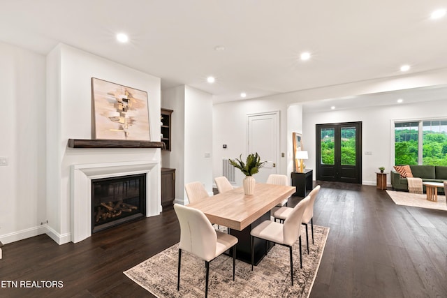 1521 Cherokee Blvd, Knoxville, TN 37919 - dining area with recessed lighting, dark wood finished floors, a glass covered fireplace, and baseboards