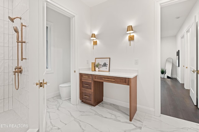 1521 Cherokee Blvd, Knoxville, TN 37919 - bathroom featuring tiled shower, marble look tile flooring, toilet, baseboards, and vanity