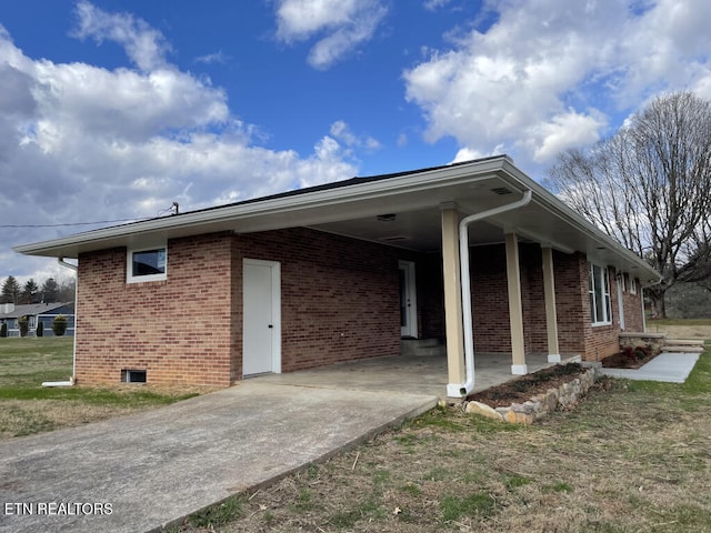 view of side of property featuring a carport