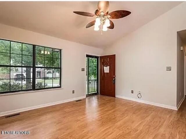 unfurnished room with ceiling fan and light hardwood / wood-style floors