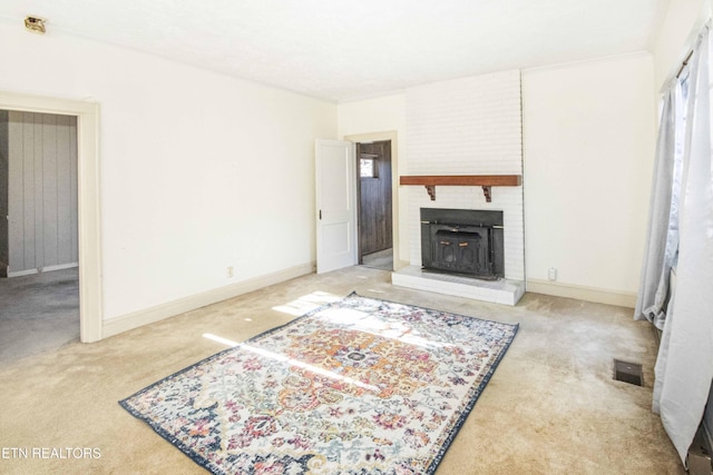 carpeted living room featuring a brick fireplace