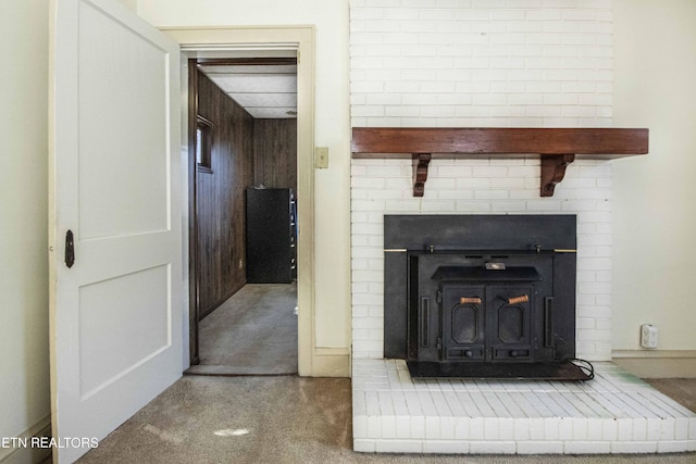 room details featuring a wood stove and wooden walls