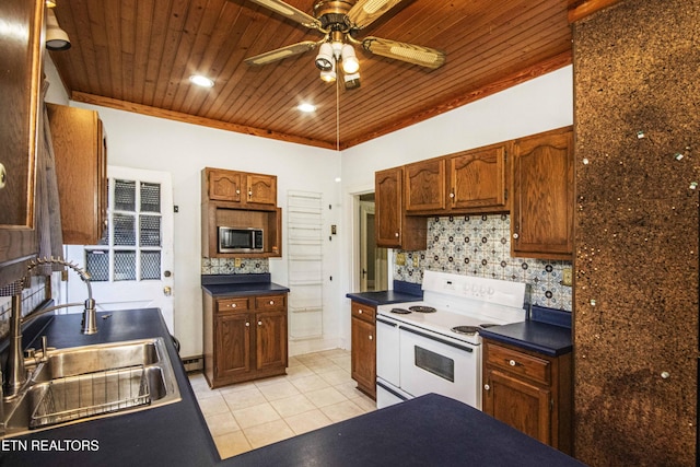 kitchen featuring white range with electric stovetop, tasteful backsplash, sink, ceiling fan, and light tile patterned floors