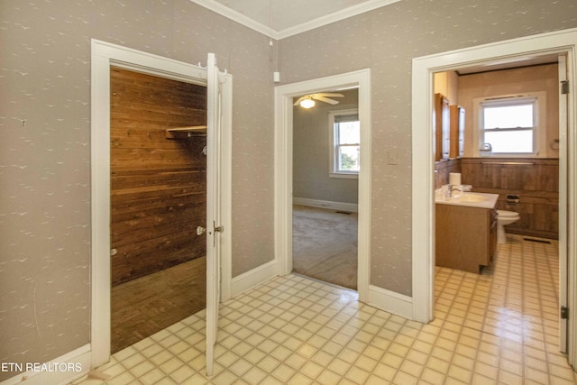 bathroom featuring toilet, vanity, and ornamental molding