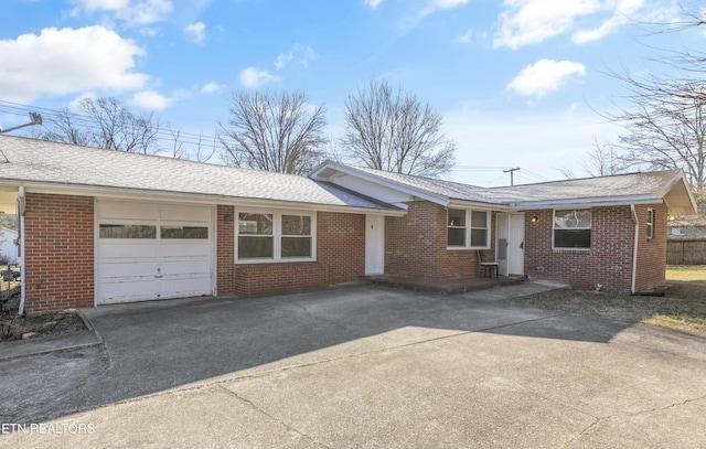 single story home featuring a garage