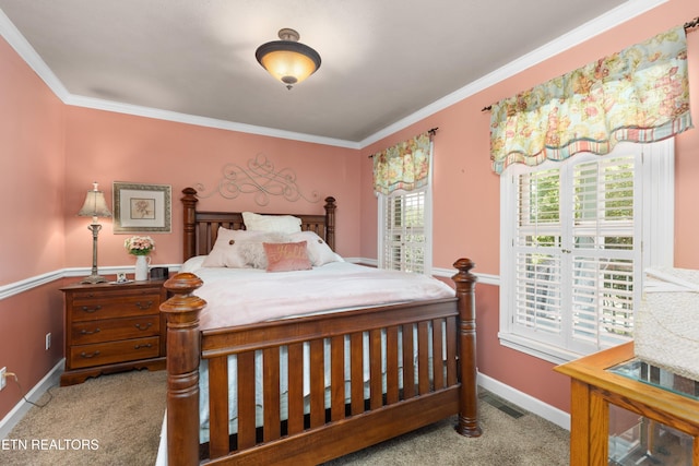 bedroom with crown molding and light colored carpet