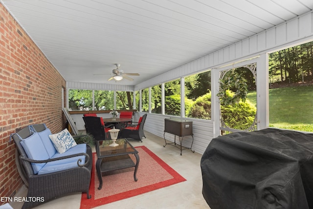 sunroom / solarium with ceiling fan