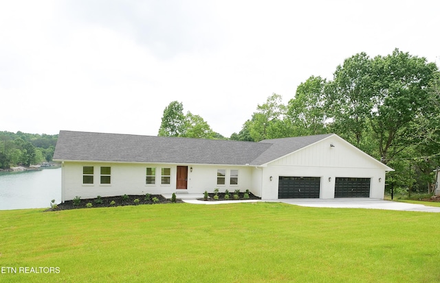 view of front of home with a garage and a front yard