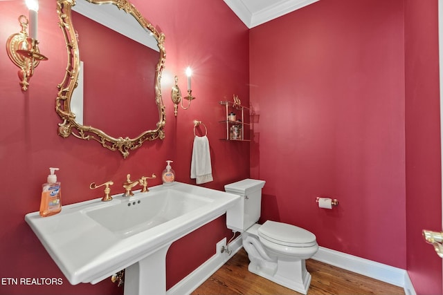 bathroom featuring hardwood / wood-style flooring, sink, and toilet