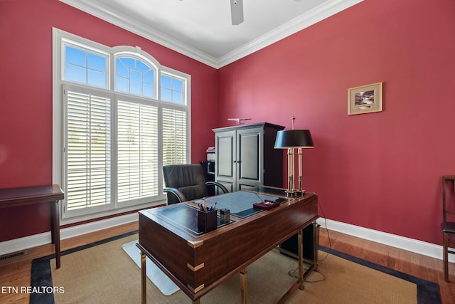 office space with ceiling fan, ornamental molding, and light hardwood / wood-style flooring