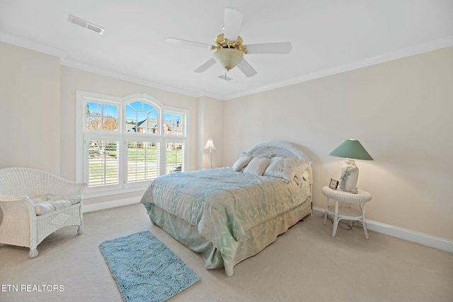 bedroom with crown molding, carpet floors, and ceiling fan