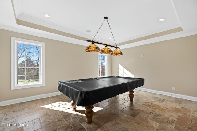 game room featuring crown molding, pool table, and a tray ceiling