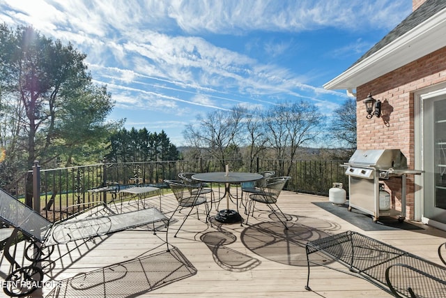 wooden terrace featuring grilling area