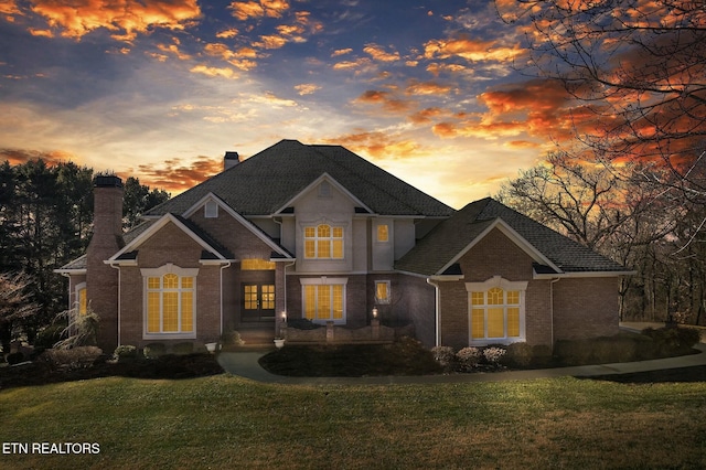 view of front of home with a lawn