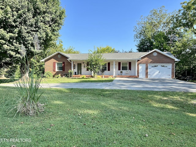 ranch-style house featuring a garage and a front yard