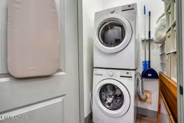 washroom with stacked washer / drying machine