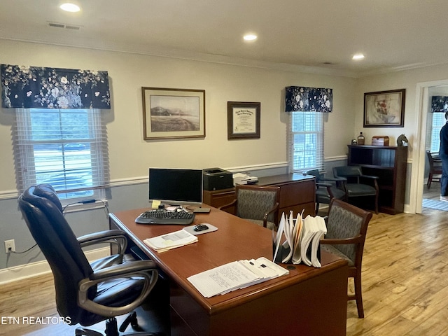 office with crown molding and light wood-type flooring