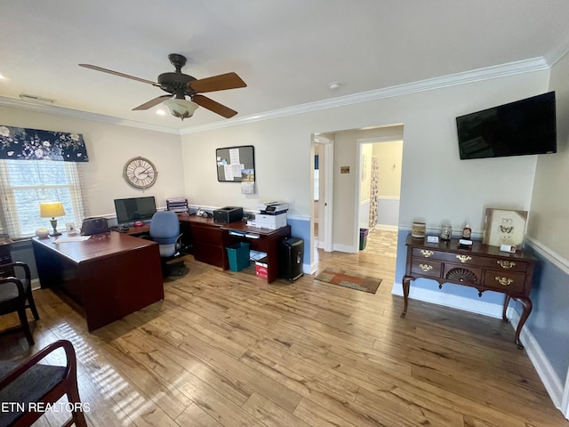 home office featuring crown molding, ceiling fan, and light hardwood / wood-style floors