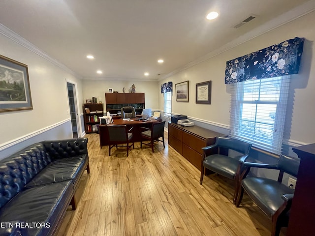 office area with ornamental molding and light hardwood / wood-style flooring