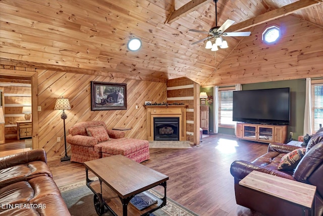 living room featuring hardwood / wood-style floors, wooden walls, wooden ceiling, high vaulted ceiling, and beam ceiling