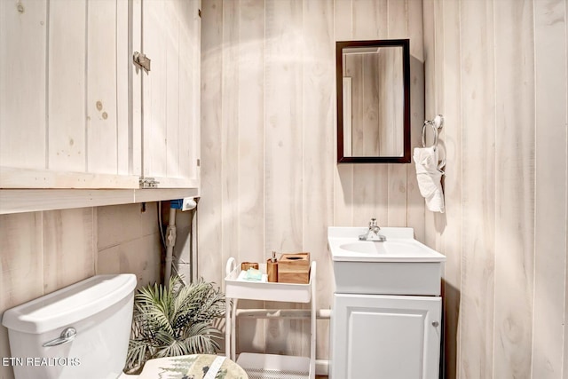 bathroom with toilet and vanity