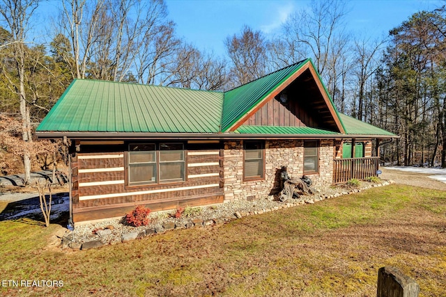 view of property exterior with a yard