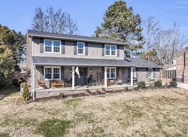 view of front of home featuring a front lawn and a patio area