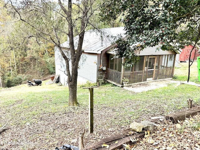 view of yard featuring a sunroom