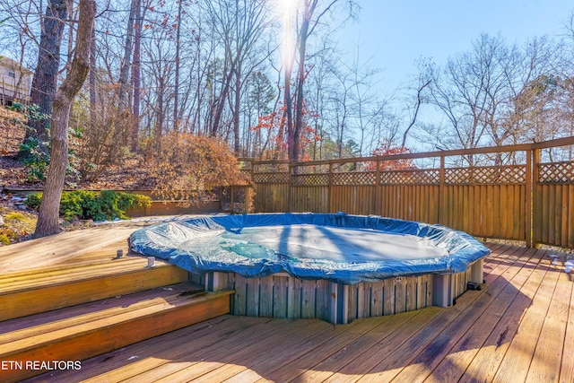 deck featuring a hot tub