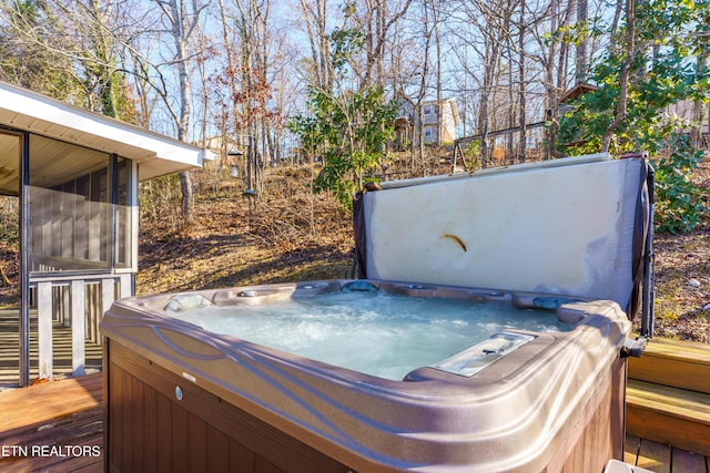 exterior space with a hot tub