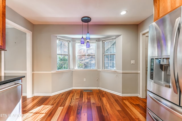 unfurnished dining area with light hardwood / wood-style flooring