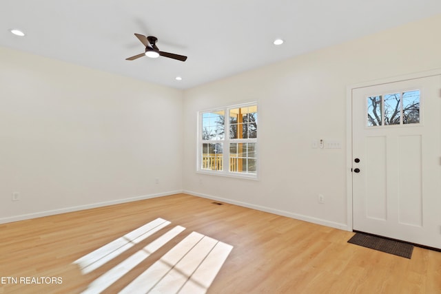 entryway with ceiling fan and light wood-type flooring