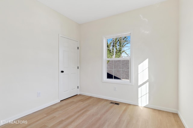 empty room with light wood-type flooring