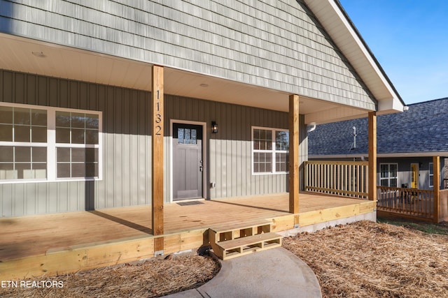 doorway to property featuring a porch