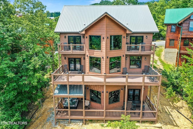 back of house with a balcony