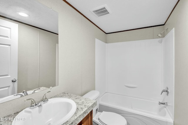 full bathroom with vanity, crown molding, toilet, and washtub / shower combination