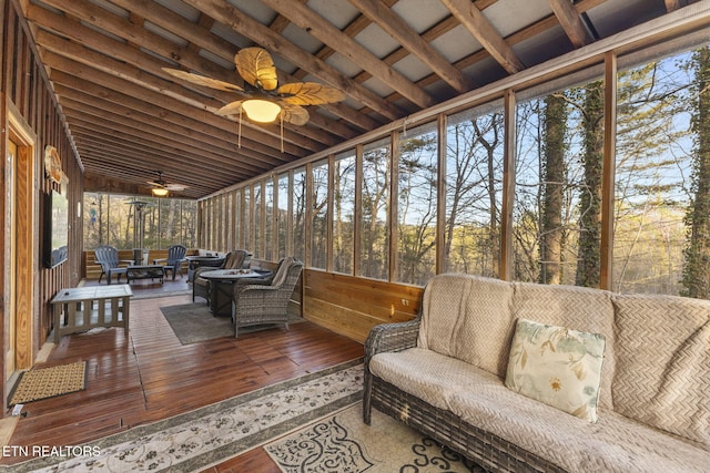 sunroom / solarium featuring ceiling fan and a wealth of natural light