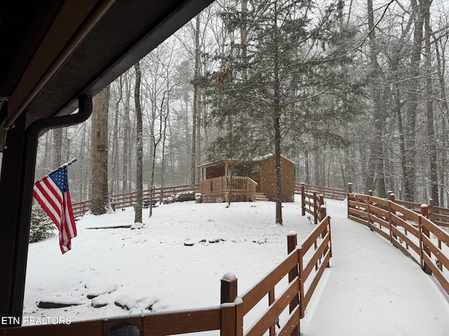 view of yard layered in snow