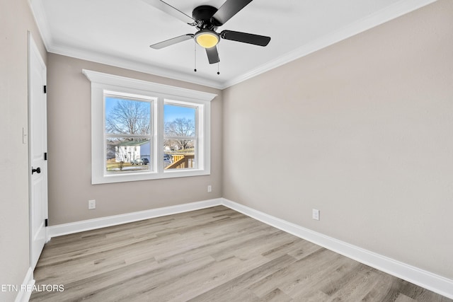 empty room featuring crown molding, ceiling fan, and light hardwood / wood-style floors