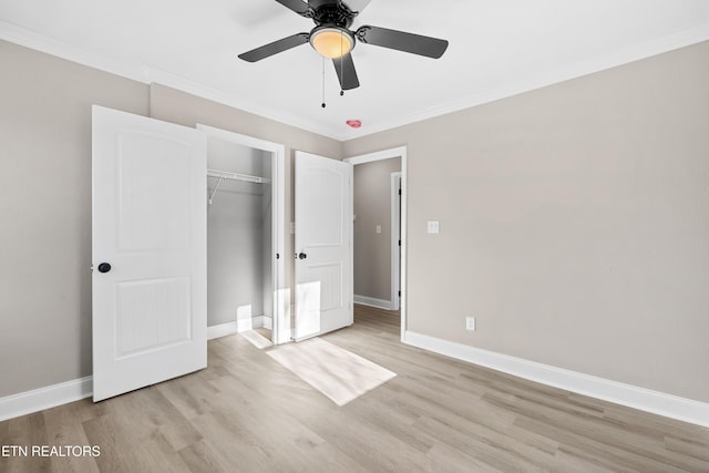 unfurnished bedroom featuring light hardwood / wood-style flooring, ornamental molding, a closet, and ceiling fan