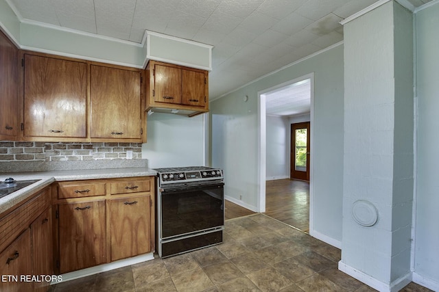 kitchen featuring ornamental molding, decorative backsplash, and black range